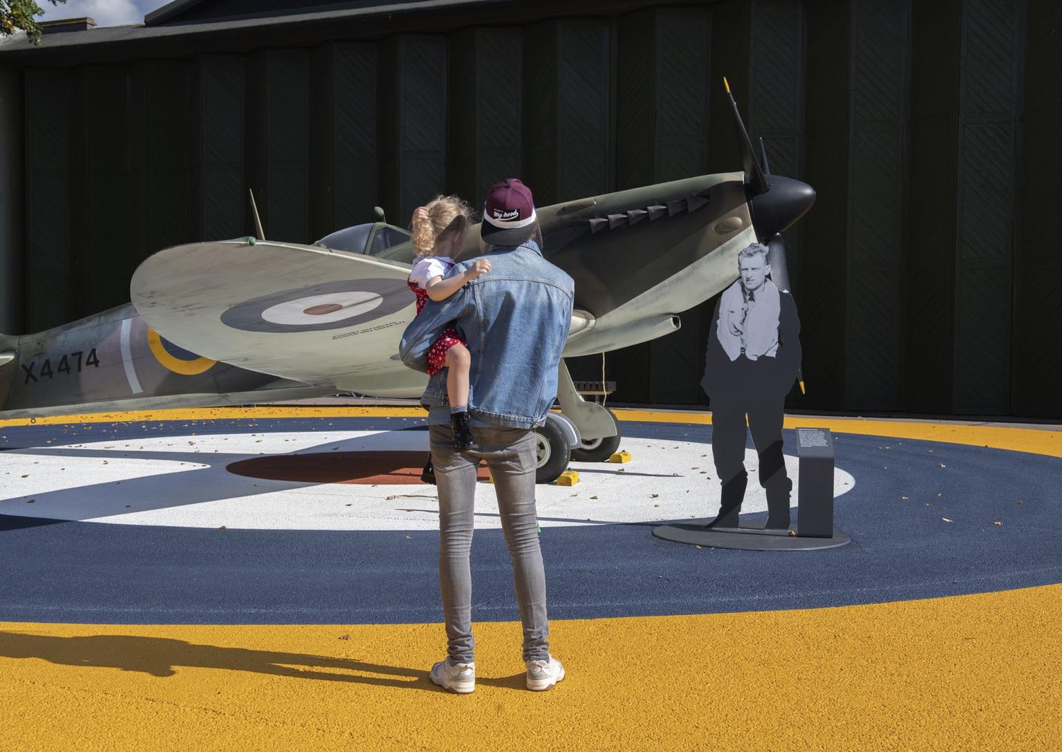 General view of visitors looking at the replica spitfire on its new roundel between Hangar 4 and 5 at IWM Duxford.Photographed 10th September 2020