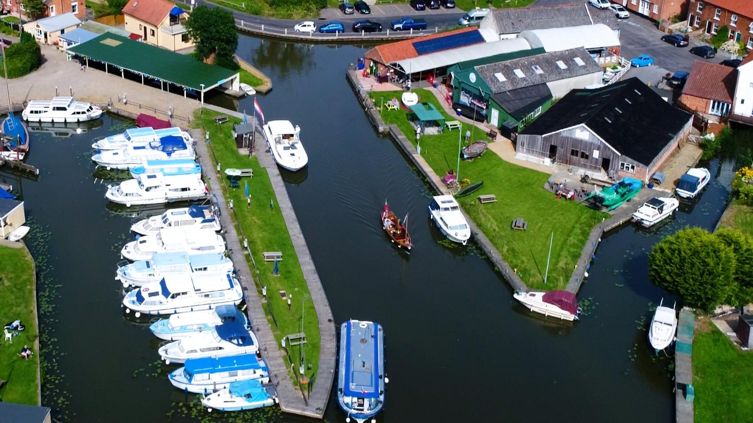 An aerial view of a harbour and museum complex