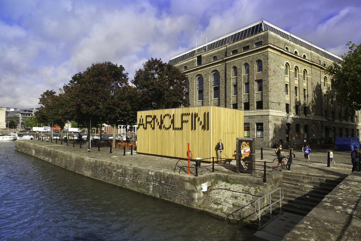 A gallery building on a dockside