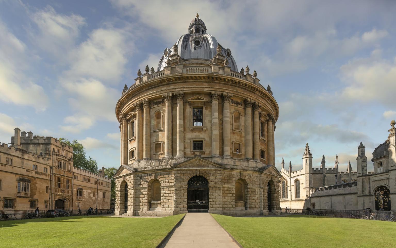 A circular building in yellow stone with a domed roof
