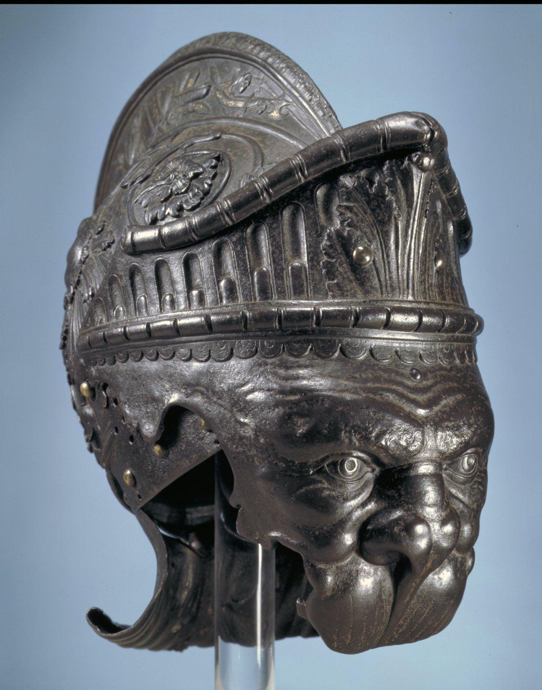 Embossed steel helmet in the form of a lions mask