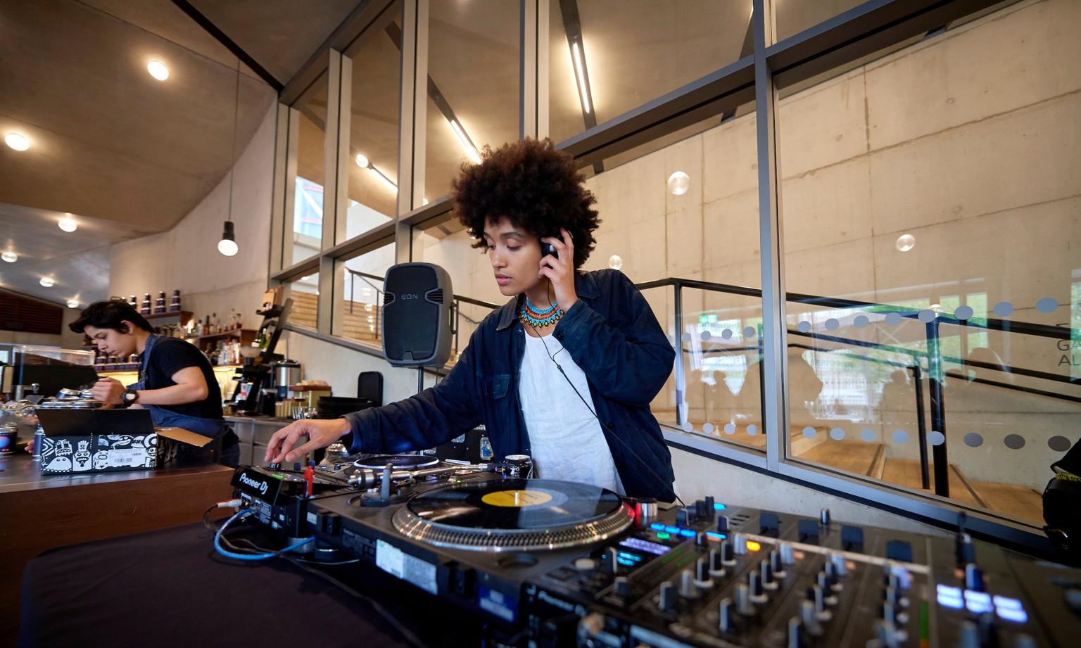 A woman DJing in the Tate Modern