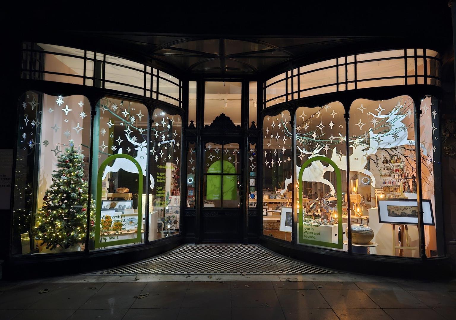 Mostyn's shop lit up with Christmas decorations/