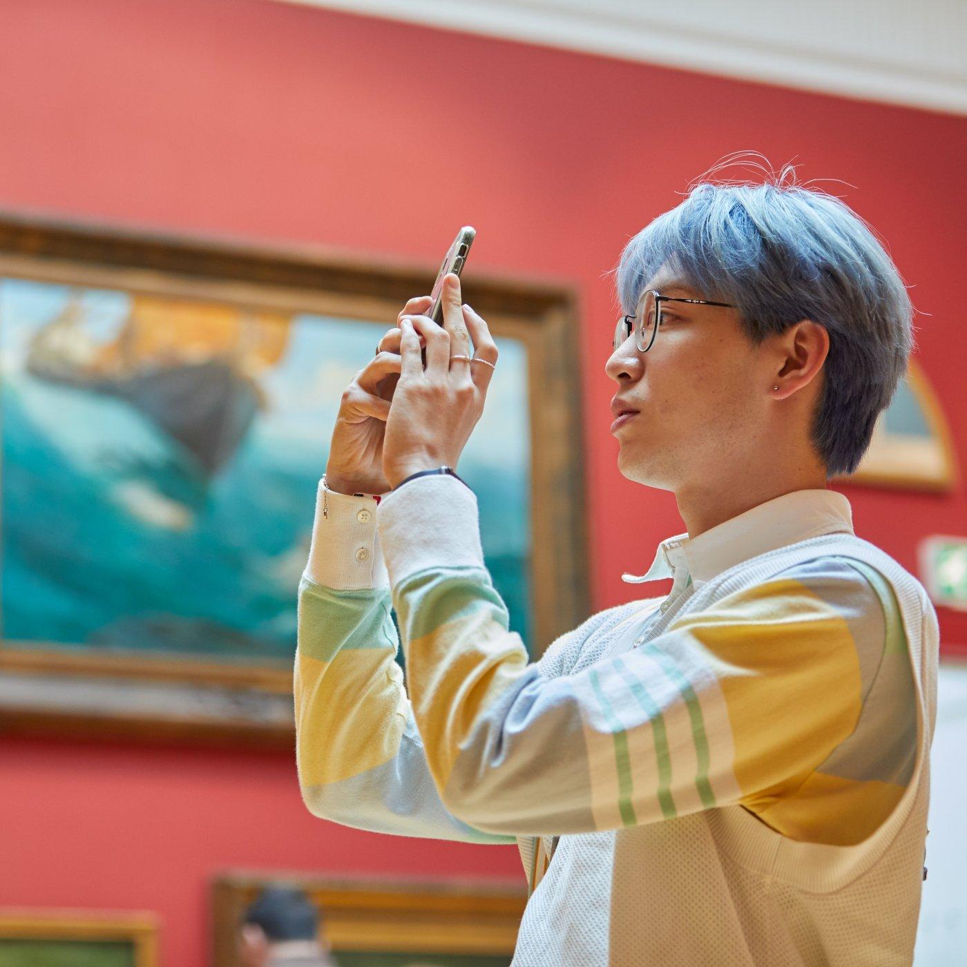 A visitor in Leeds Art Gallery's permanent collection