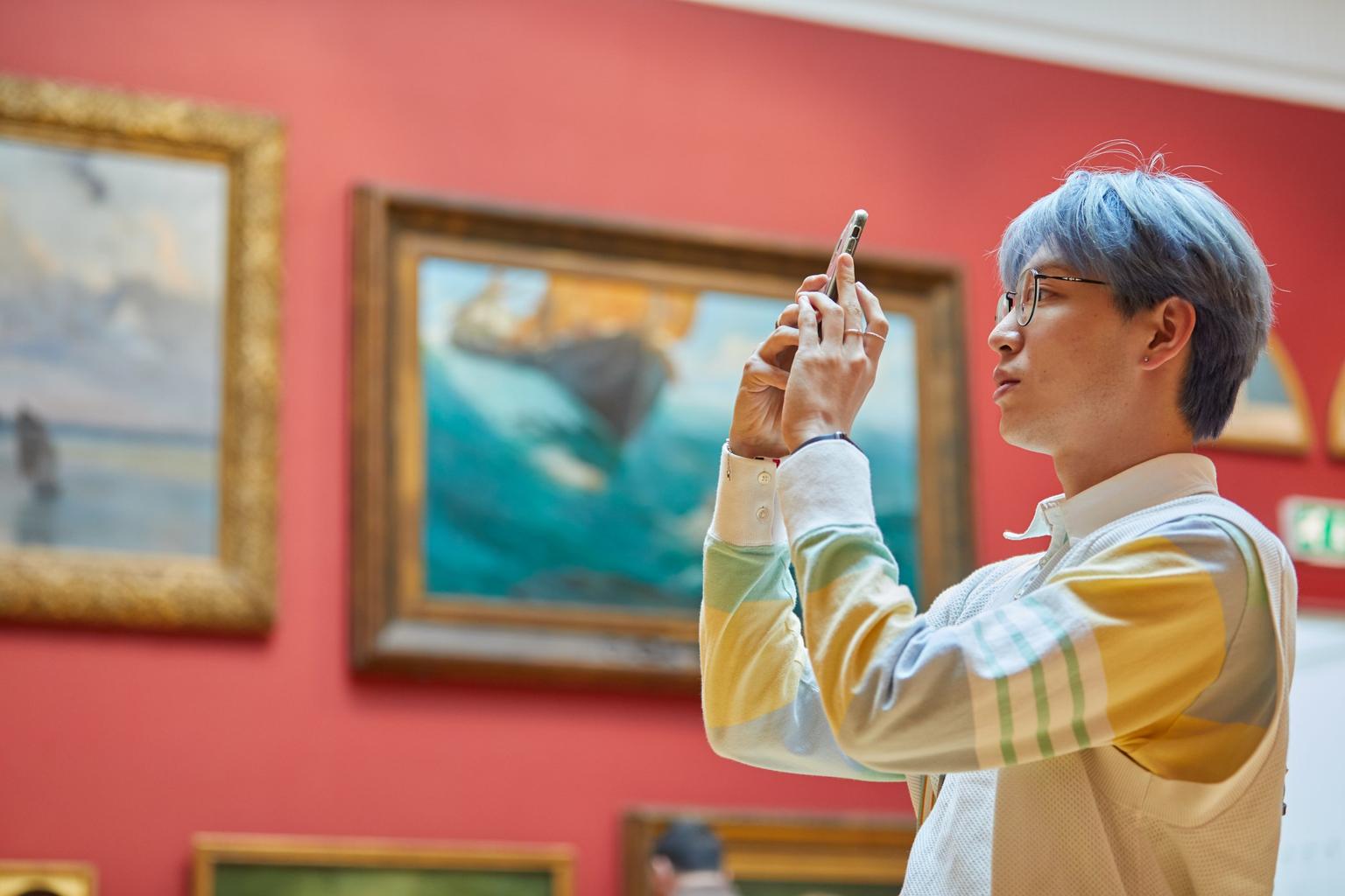 A visitor in Leeds Art Gallery's permanent collection