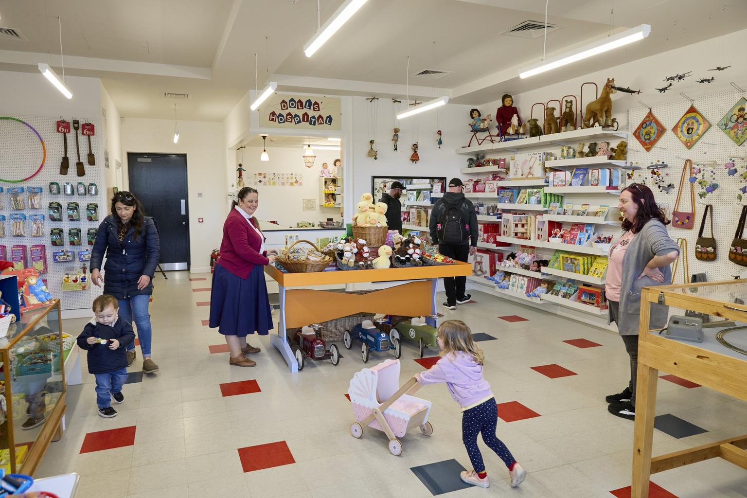 A children's toy store selling a range of toys from traditional historic dolls and old-fashioned cars to wooden pram and soft toys.