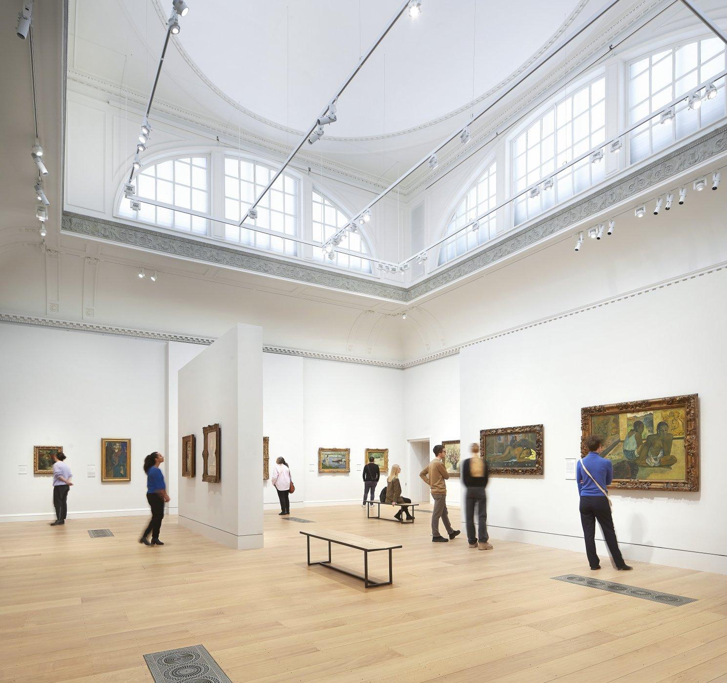 Visitors explore the Great Room at The Courtauld Gallery
