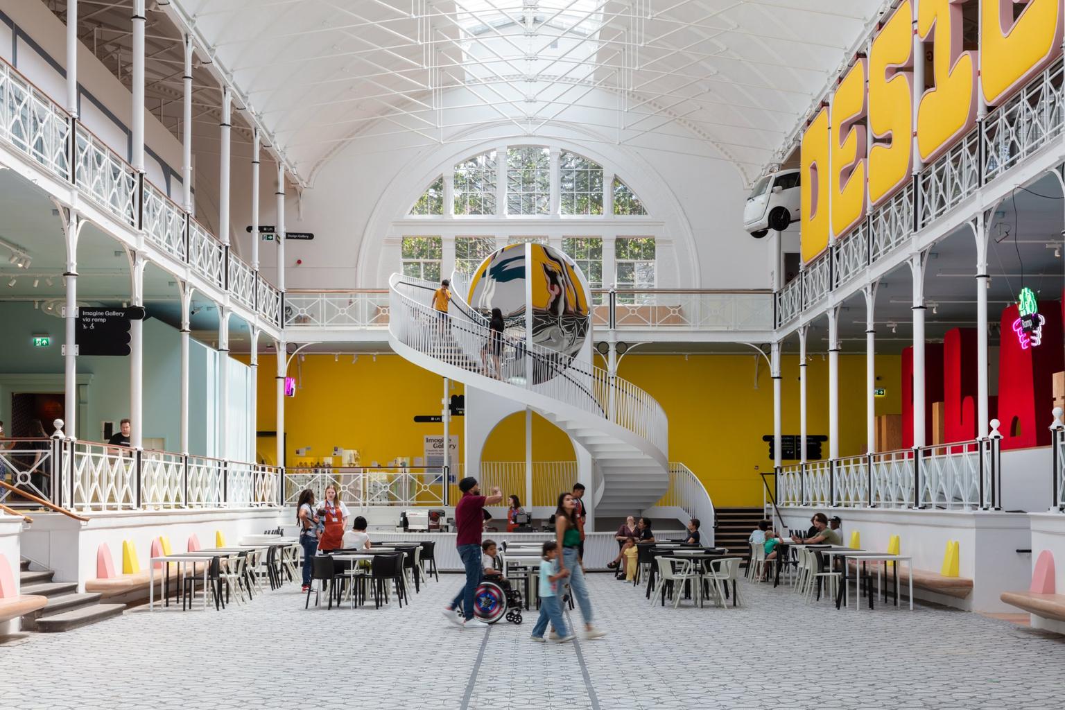 The central space inside the Young V&A with tables and balconies