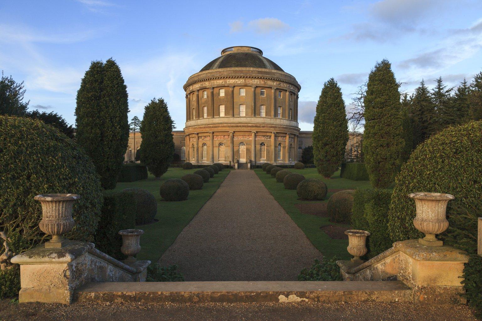 A stone rotunda in warm evening light