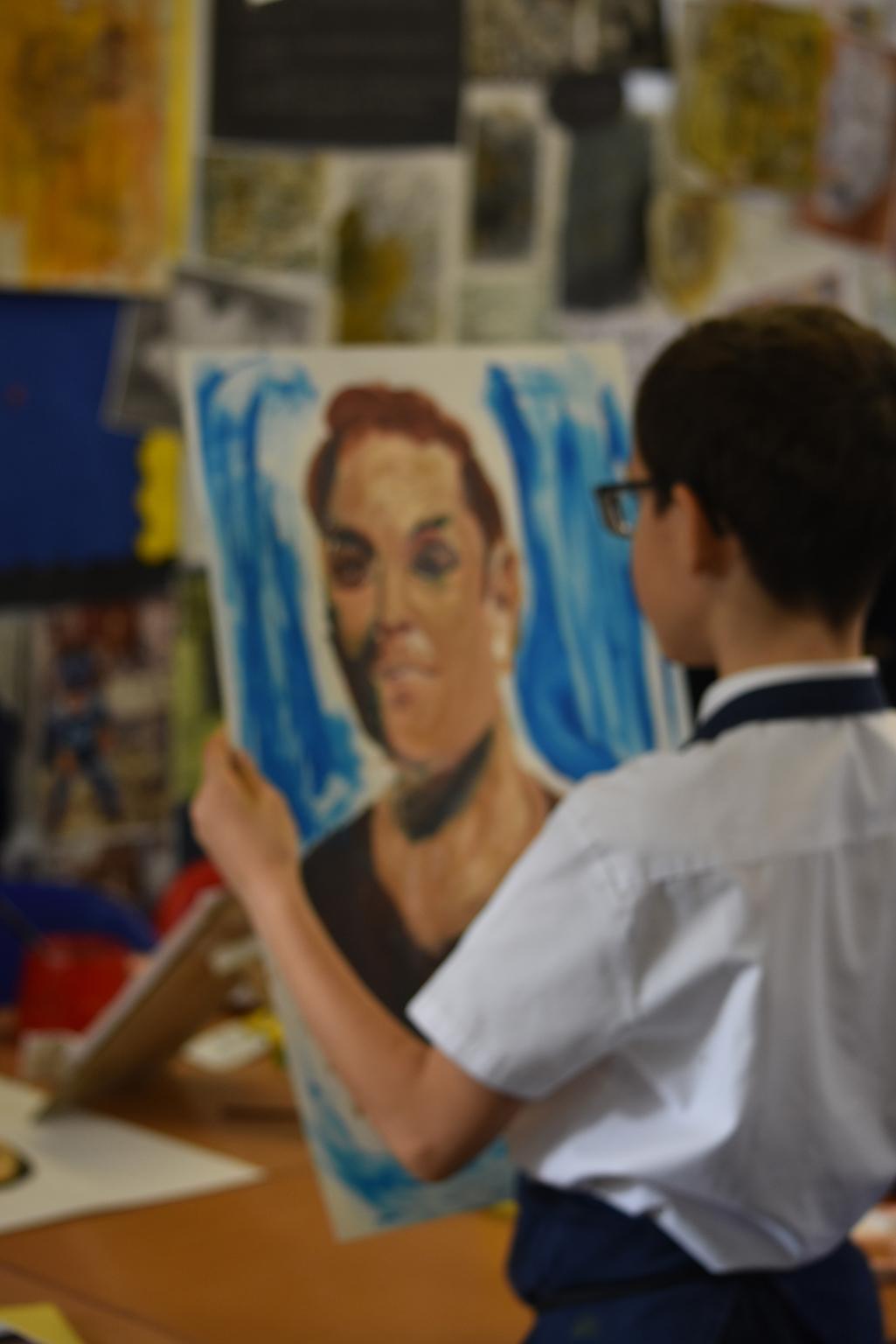 A pupil enjoying an art lesson at Preston Park Primary, Wembley, London, 2019,
