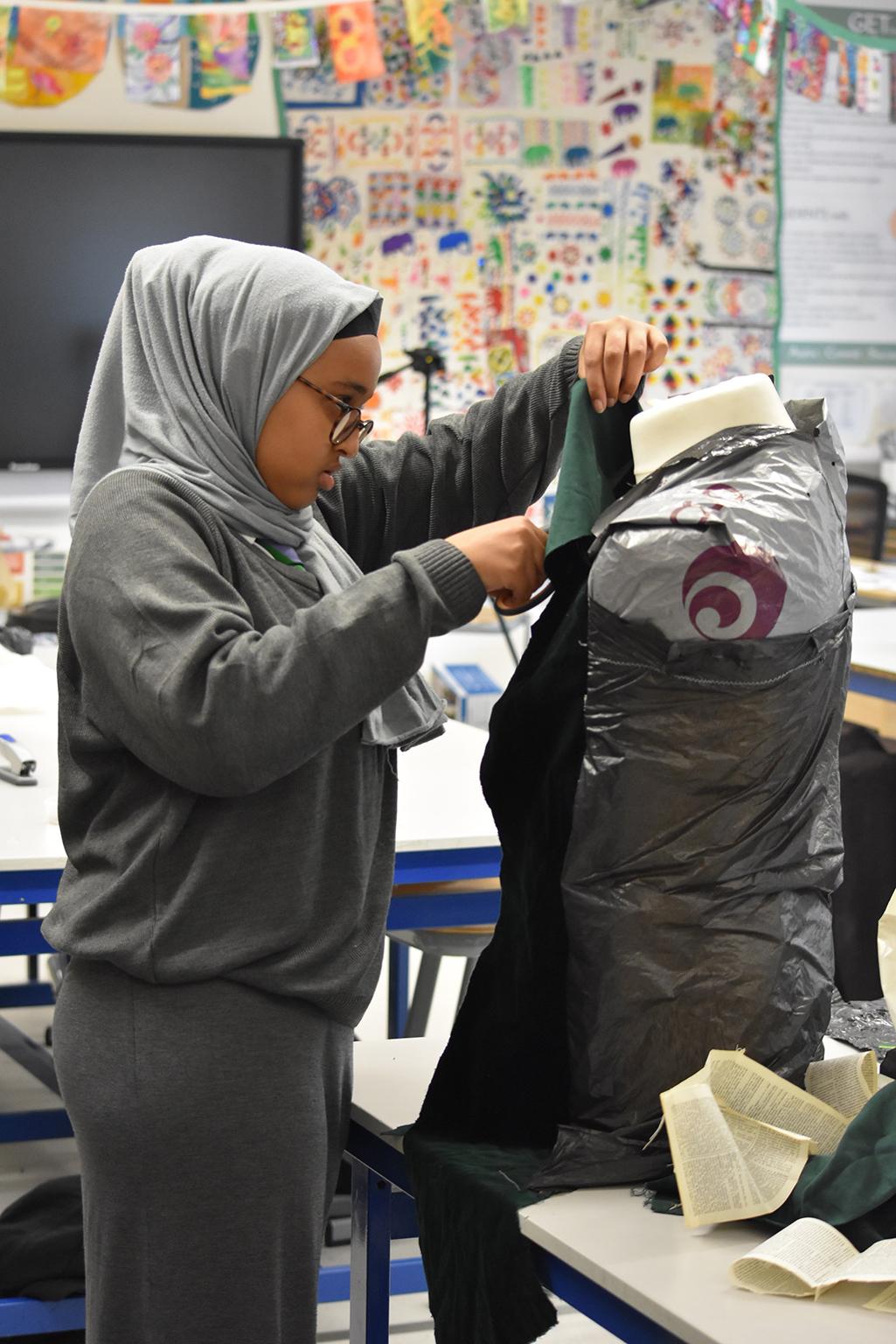 A pupil working on a design at Alperton Community School, Brent, London, 2019
