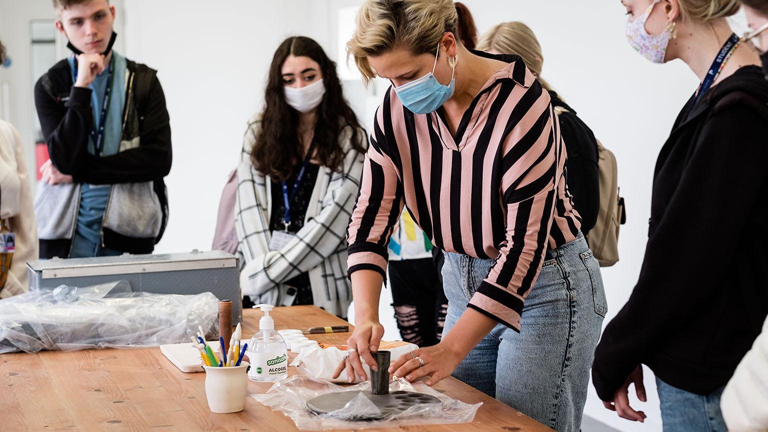 Participants in a medallion-making workshop