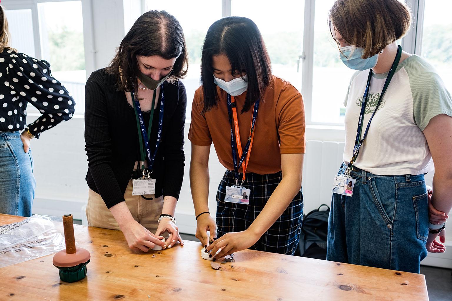 Participants in a medallion-making workshop.