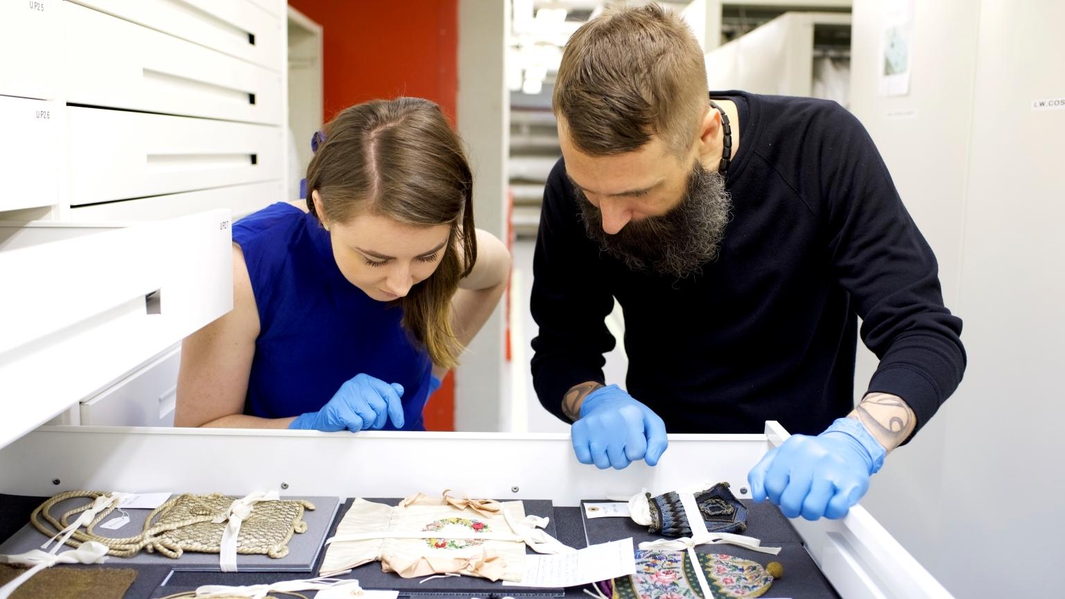 Timothy A. Long, Curator of Fashion & Decorative Arts and Dr Danielle Thom, Curator of Making, inside the Costume Store at the Museum of London