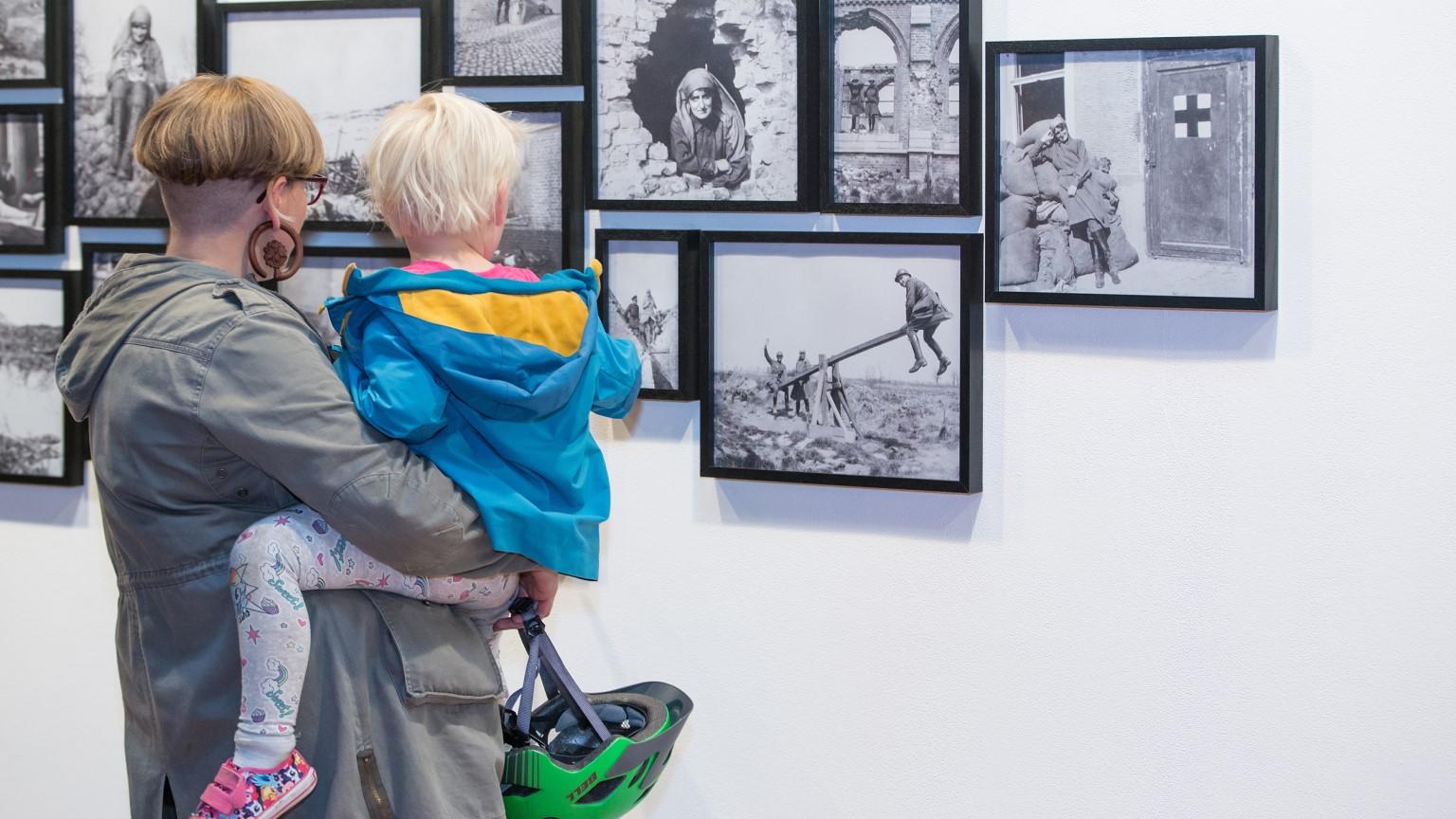 Exhibition visitors viewing work by Mairi Chisholm