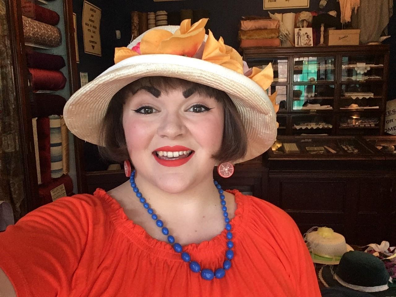 Laura trying on a hat at Preston Park Museum.